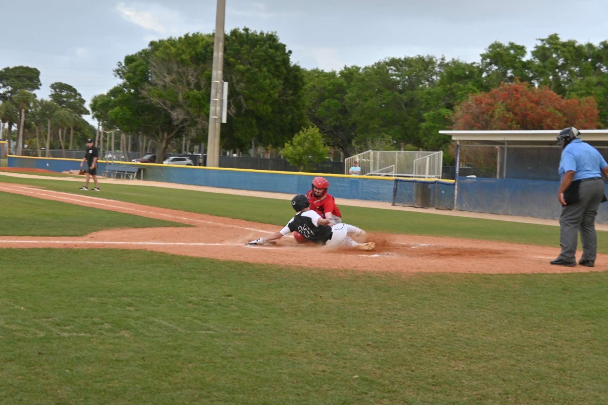 Senior baseball captain Adam Gall slides into home plate during one of the teams scrimmages. Adam brings experience and leadership to a team full of young players. Baseball has peaked the interest of many underclassmen and could be poised for a rise in players in the coming years.  
