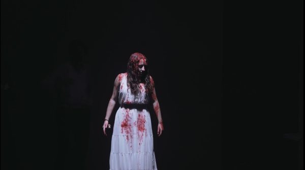 Recently, Cara performed in Carrie the musical at Sandbox Theatre. She played the character of Carrie, and got to experience what is was like to get in character during different situations . Here, she wore a beautiful white dress drenched in blood, something that is not typically worn, to depict her character throughout the scene.