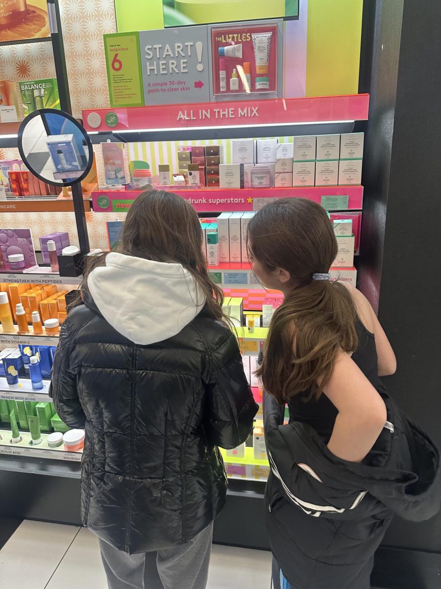 Two ten year old girls browsed the aisles at Sephora. They stopped at the Drunk Elephant stand and looked at the retinol products. These products are harmful to childrens skin and can cause aging rather than anti-aging.