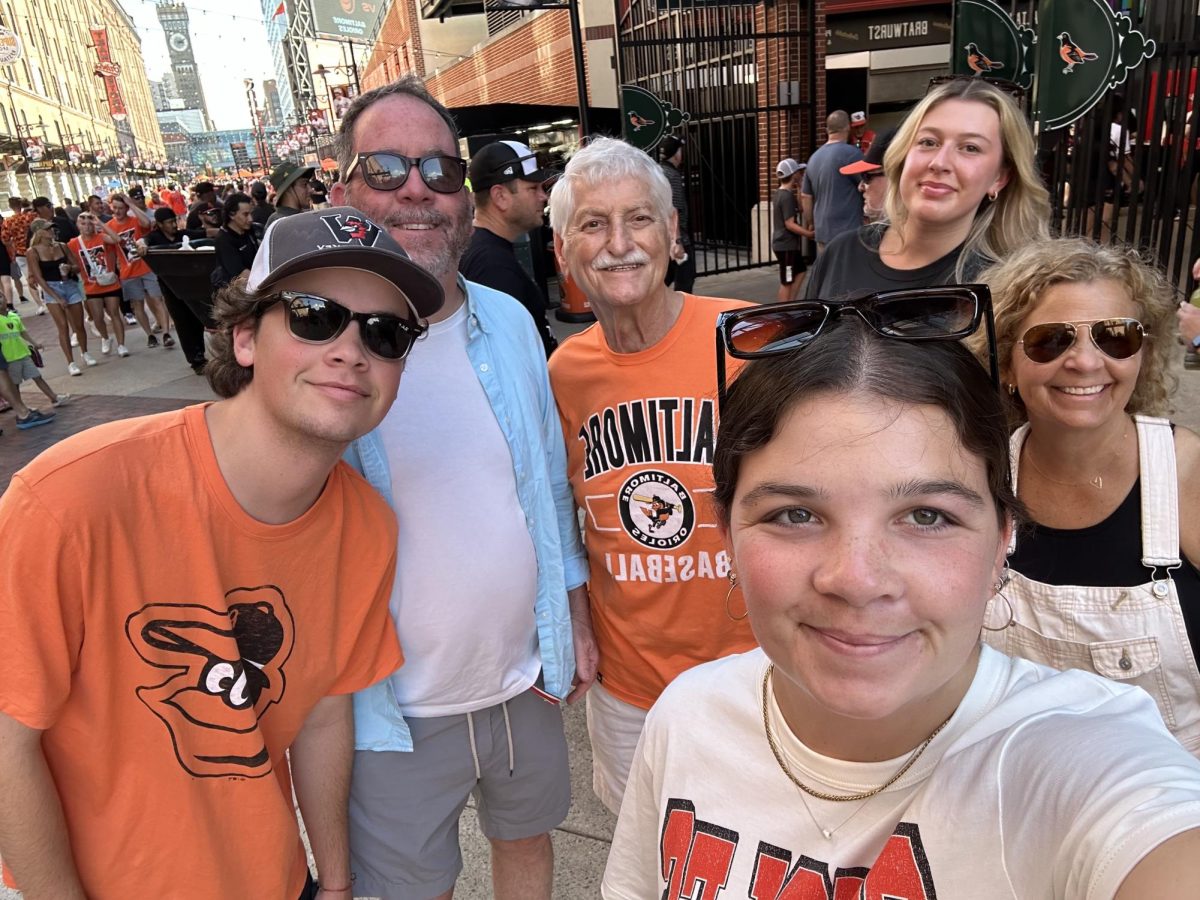 English teacher Jenny Leffler and her family watch a Baltimore Orioles game. 