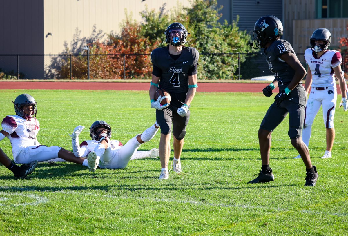 Senior Will Belleville celebrates following a touchdown catch en-route to Hackley's 35-16 victory over Riverdale.