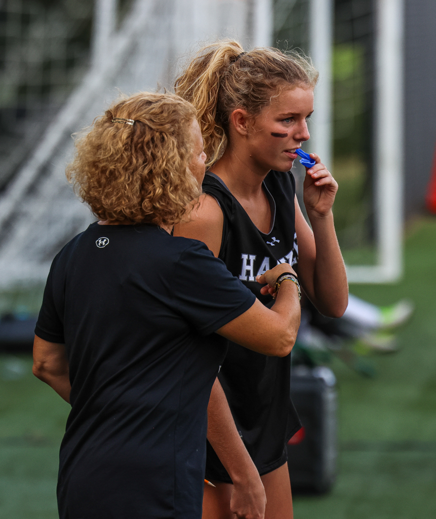 Before subbing freshman Nora Esposito into the Hornets' game against Horace Mann, Coach Leffler offers advice. She typically gives specific instructions and targets to focus on as she prepares to enter the field. "I'm pretty sure Leff was telling me to fight for second chances here. We were trying to possess the ball more," said freshman Nora Esposito.