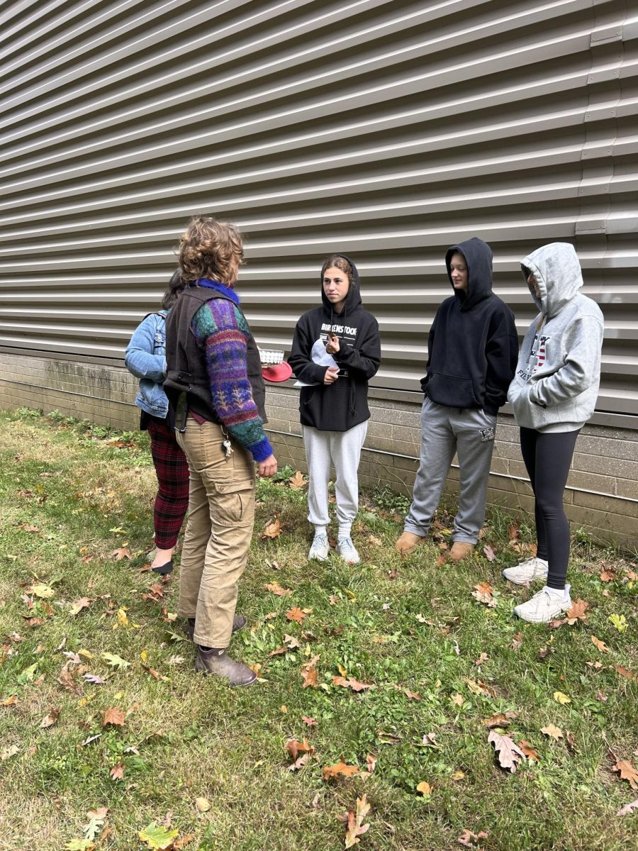 The students walked around the Johnson Center searching for various types of plants and flowers to forage. Sarah Lucas 01' brought in dried plantain leaves for the students to try that she cooked earlier that day. 