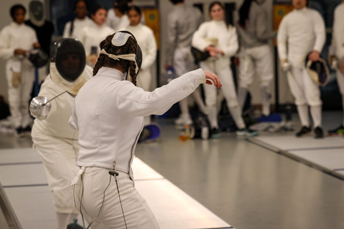 Hackley Varsity Fencing Team faces Masters during a home match.