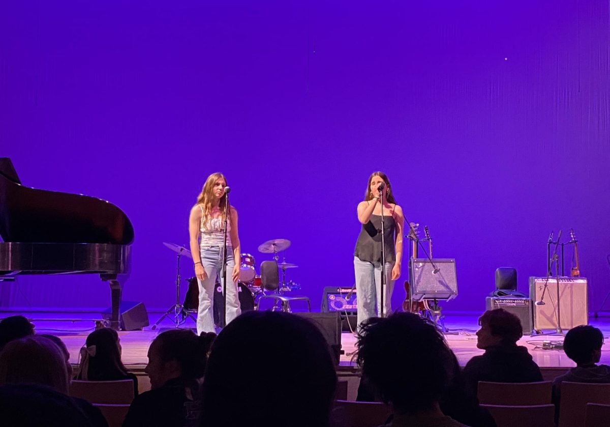 Seniors Ava Derby and Rebecca Ingles singing "Stranger" by Olivia Rodrigo. The audience watched in awe as they harmonized.