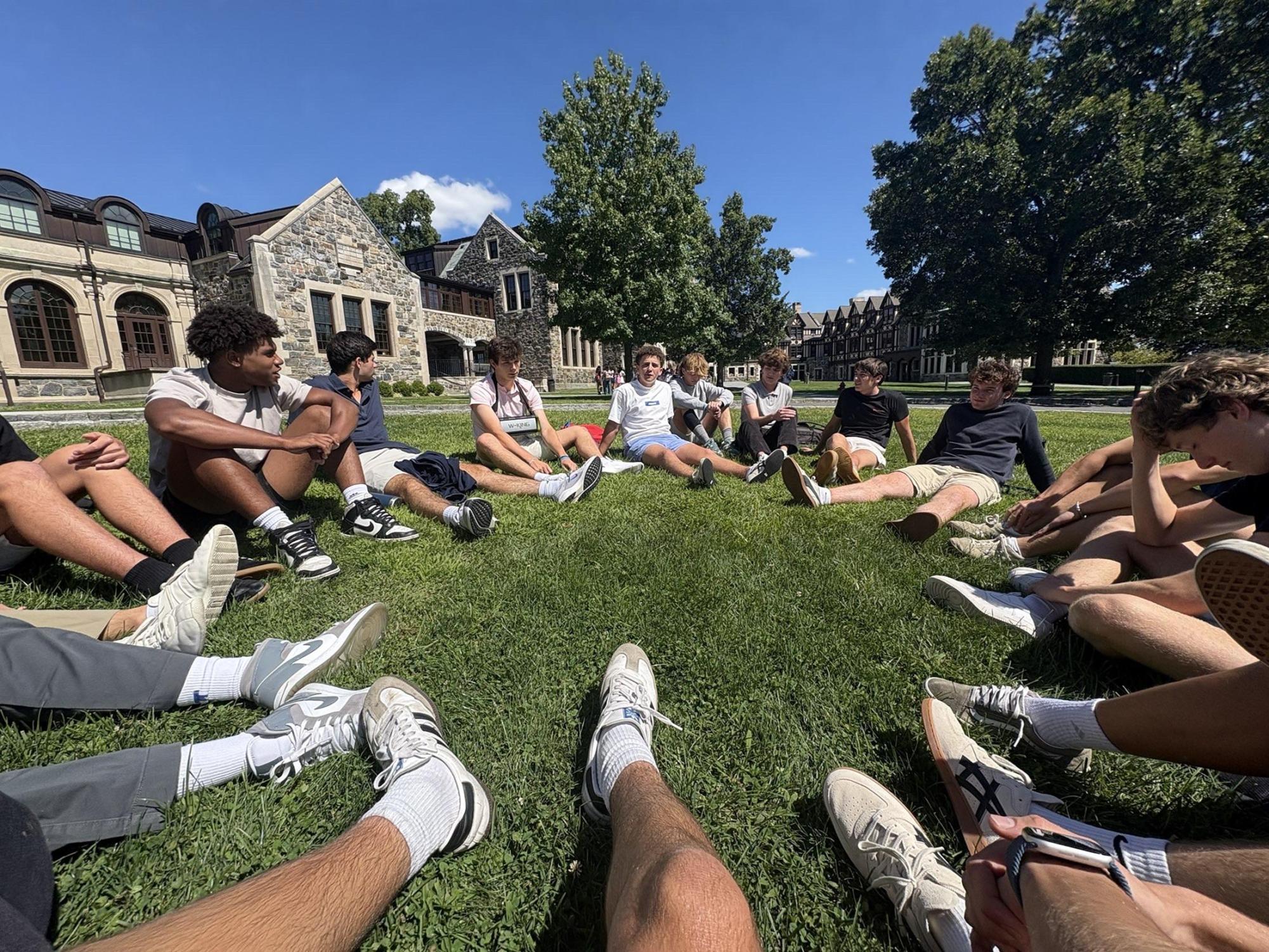 Seniors gather on the quad during the first day of school. Without the ability to use phones, many were just talking or listening to music. Some students had their own cameras, which they used to take pictures of themselves and their friends—photo courtesy of Mateo Arencibia.