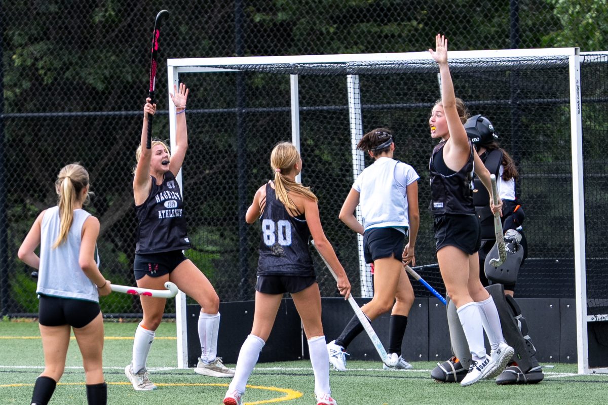 Charlotte Frazier, 10th grade, Adelle Hostetler, 9th grade, and Erin O’Rourke, 8th grade, all members of the girls field hockey team. They are celebrating their goal made during preseason. Showing the connection and support between grade levels.
 (Photo courtesy of Sarah Sichel-Outcalt)