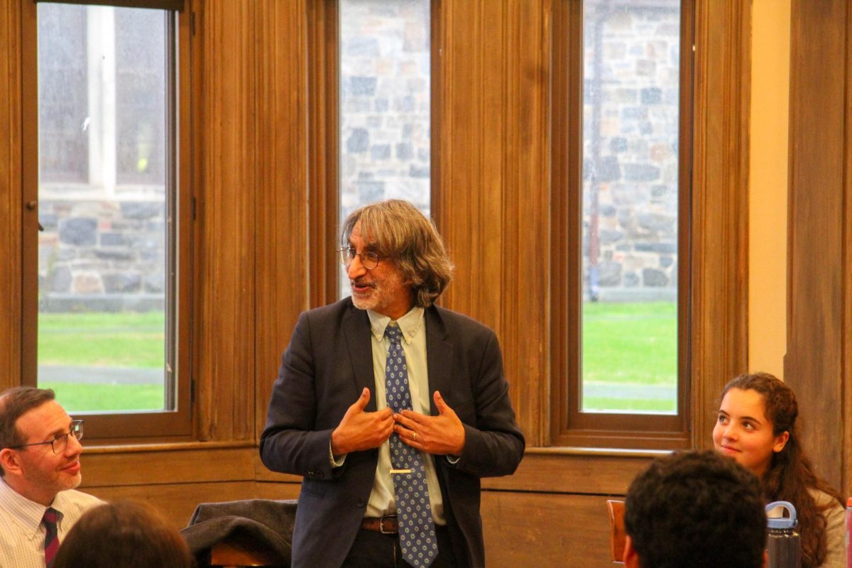 Professor Amar speaking at the lunchtime Roundtable, and Mr. Bass and senior Annika Duggan looking on. Passion for the Constitution cascaded from Professor Amar while speaking, radiating from the students as well. "In my dream world, I’d want them to have read some things that I have written,” Professor Amar said on what people could do to prepare for constitutional discussions. 