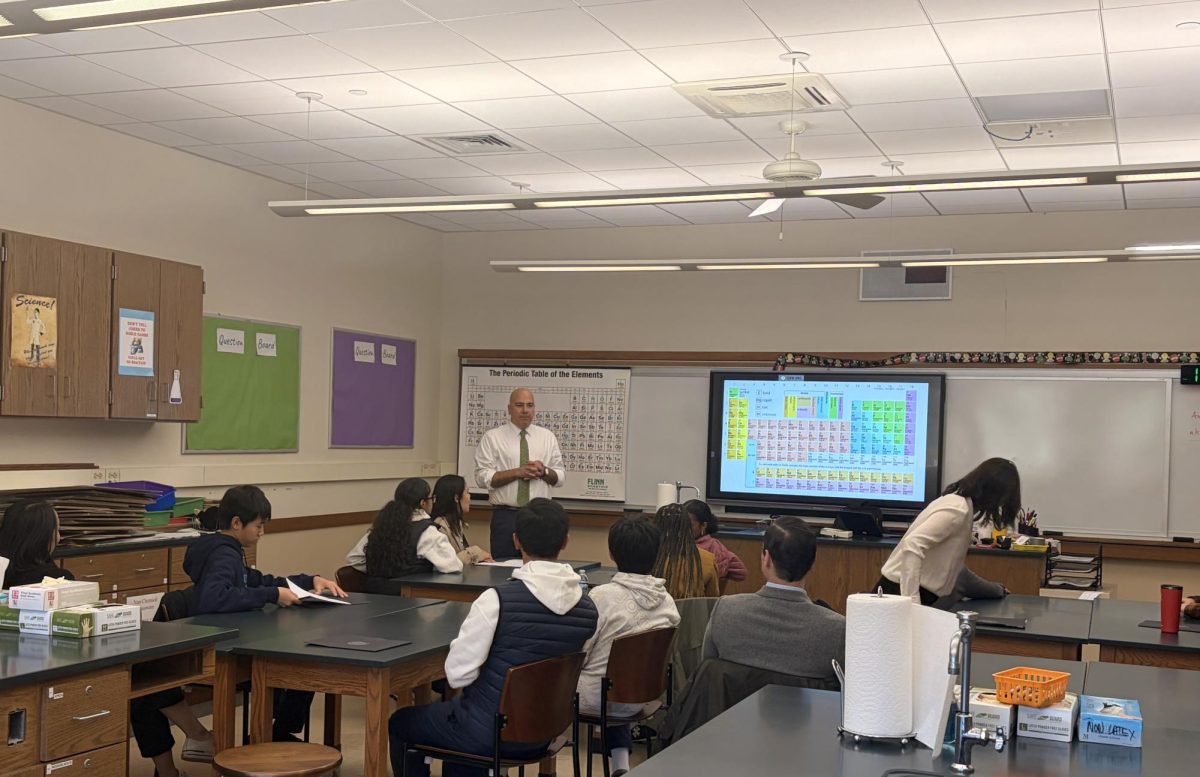 Director of the Upper School Andy King filled in for Chemistry teacher Katherine Hannon's class. He gave the group an overview of the science department and the history department. Then he led the group in one of his favorite lessons from when he used to teach 10th grade United States History.
