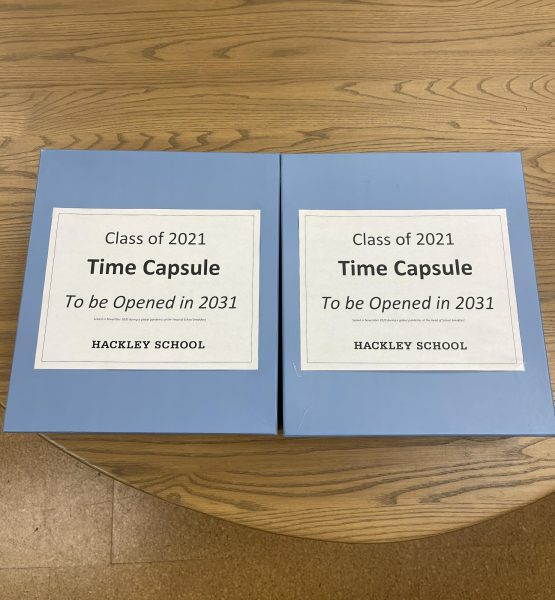 Located in the Hackley archives is the time capsule from the senior class of 2021. Inside, students signed the lids, put in old ID's, tests, and other items they felt recapped their time as a Hackley student.