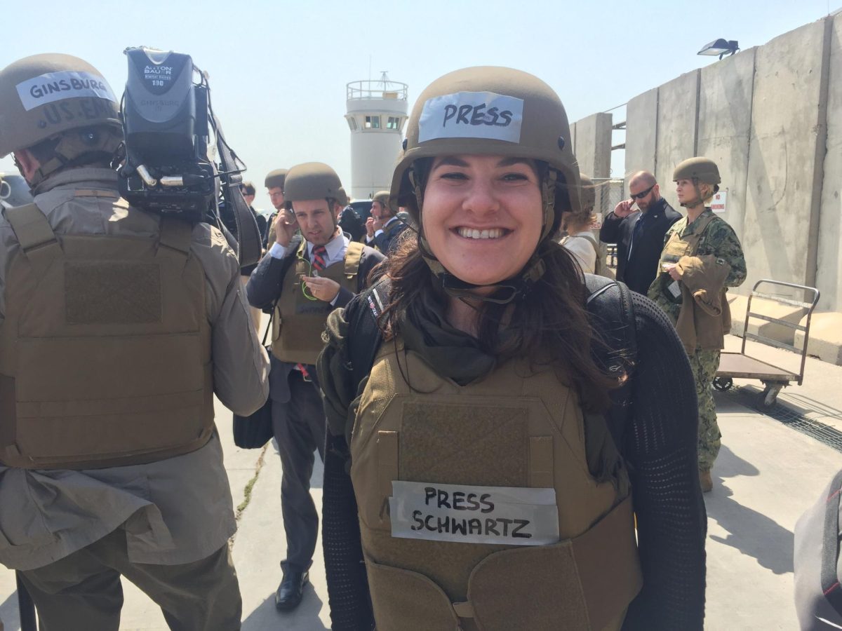 Felicia Schwartz ’10 is decked out in press-labeled protective gear. Her reporting on the ground in these conflict zones reflects her work of telling the stories of global events firsthand from the front lines of history. (Photo courtesy of Felicia Schwartz)
