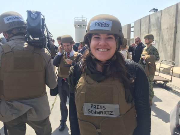 Felicia Schwartz ’10 is decked out in press-labeled protective gear. Her reporting on the ground in these conflict zones reflects her work of telling the stories of global events firsthand from the front lines of history. (Photo courtesy of Felicia Schwartz)