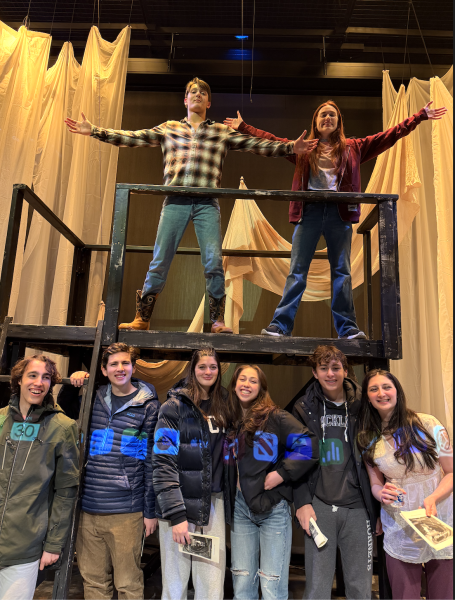 Juniors in the cast of Anon(ymous) including Andre McMahon and Sofia Mazzella are standing on one part of the carefully constructed set. Below them stand a group of upper school students holding playbills after watching the show. The packed black box theater was full community members of all ages, who provided their support across the 6 show run. Photo courtesy of Sofia Mazzella