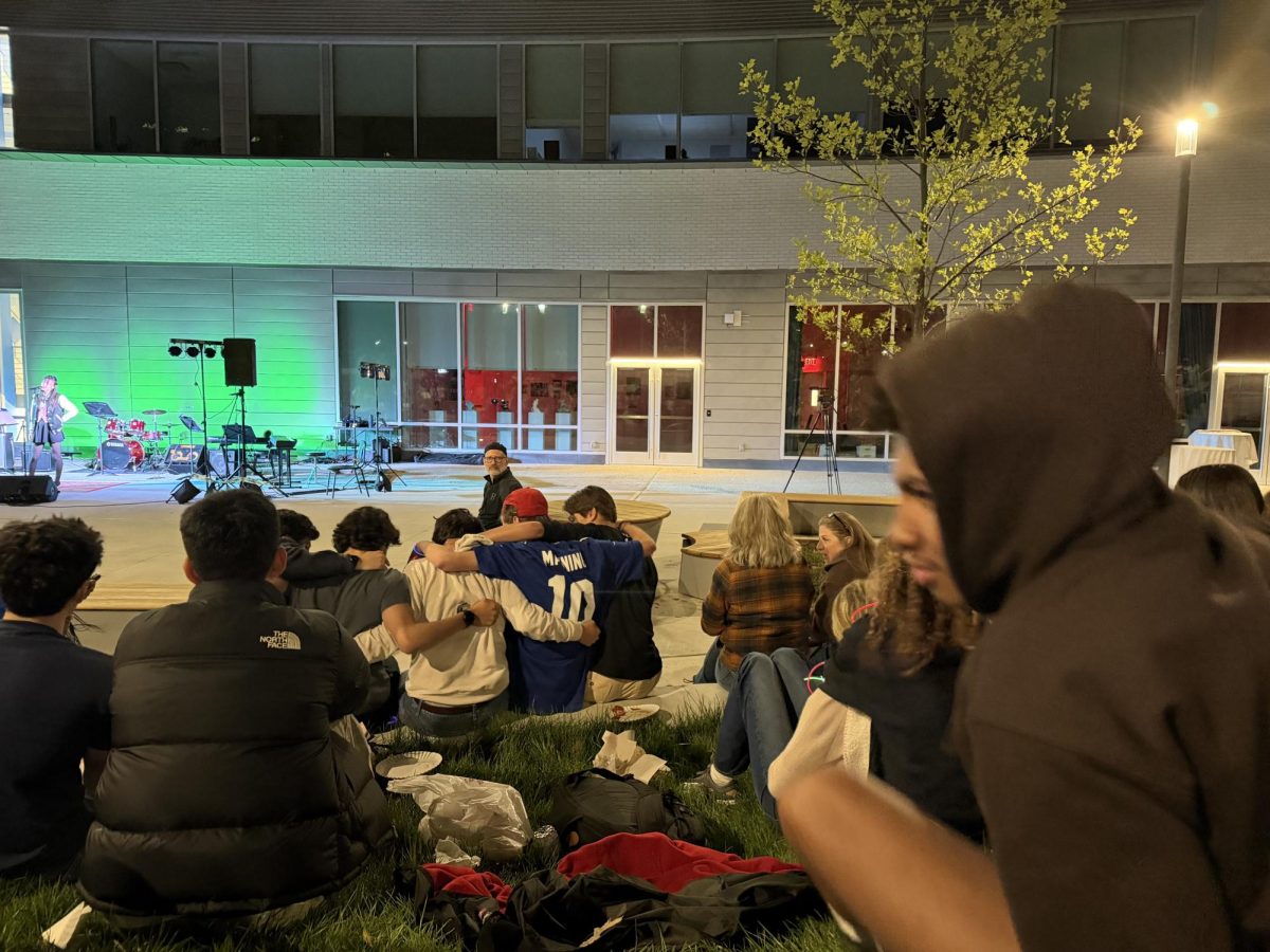 Since it was the first year Coffehouse has been outside, friends were able to huddle together. After performing, junior Gabriel Fossner and his friends were able to crowd together in between the next performances. The new adjustment to the coffeehouse allowed for a more intimate feel. 