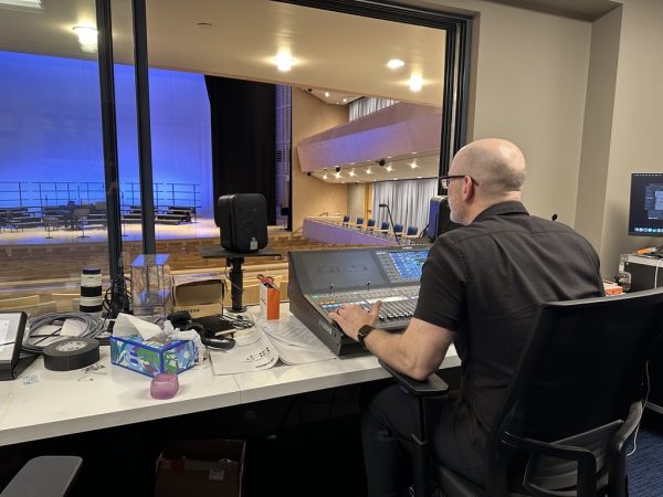 Mr. Chalfy tests the new sound system in Diller Hall. He is able to add effects and adjust the EQ of audio and microphone input.