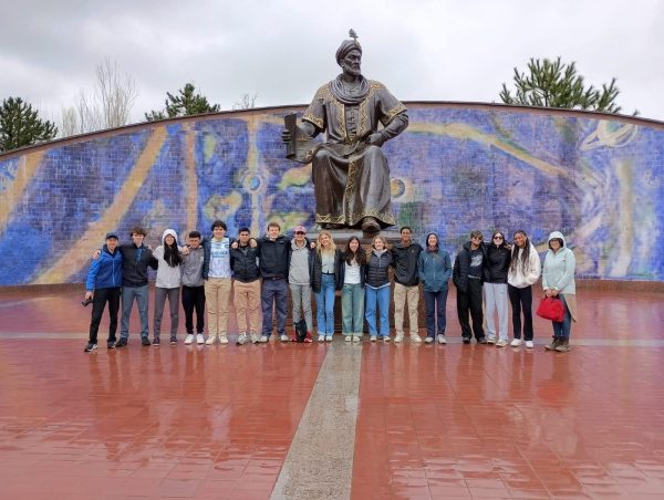A group of students posing together in front of a statue during the Uzbekistan trip.

Photo Credit: Dr. Liu